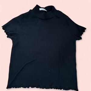 Black mock neck top with lettuce hem